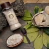 A container of rock salt beside a wooden spoon, emphasizing the natural elements of cooking and seasoning.