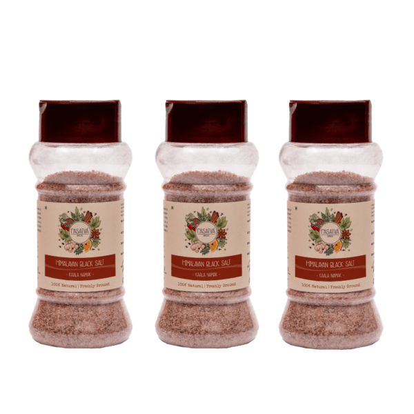 Three bottles of Himalayan black salt powder displayed on a clean white background, emphasizing their unique texture and color.