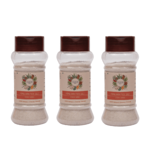 Three clear bottles containing Himalayan rock salt powder.