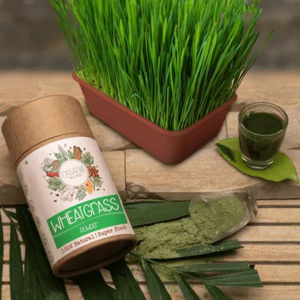 A vibrant green wheatgrass powder, finely ground and spread out on a white surface, highlighting its rich color and texture.